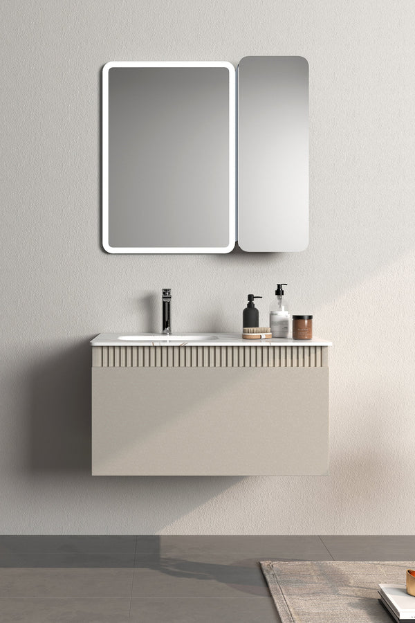 Modern bathroom with a sink vanity, mirror, and bathtub.