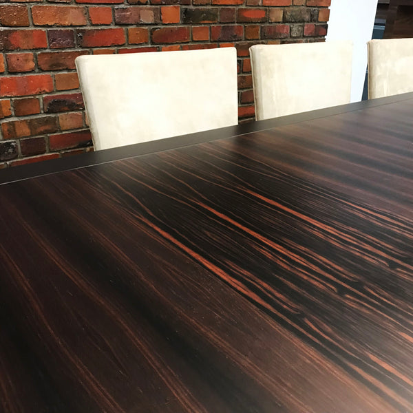 Bespoke Ebony Dining Table Made in Singapore Workshop by HomeShake with Brick Wall and White Dining Chairs