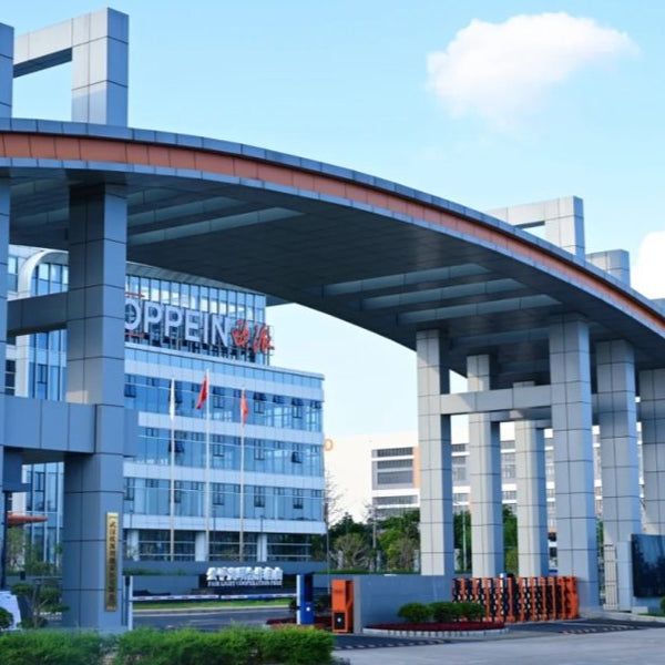 Modern building with 'OPPEIN' branding under a clear blue sky