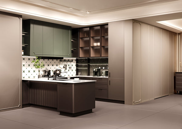 A modern kitchen interior with dark green shaker doors upper cabinets, a central island in dark brown wood, a white patterned tile backsplash, and beige sliding cabinet doors on the right side.