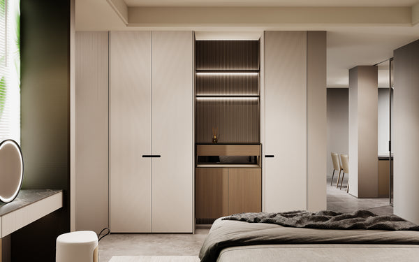 Modern bedroom with a large wardrobe and bed.