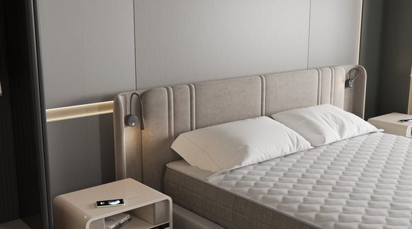 Bedroom with a bed and nightstands featuring a smartphone on one of the nightstands.