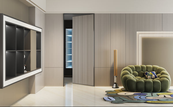 Modern living room with a green sofa, wall-mounted TV, and decorative elements.