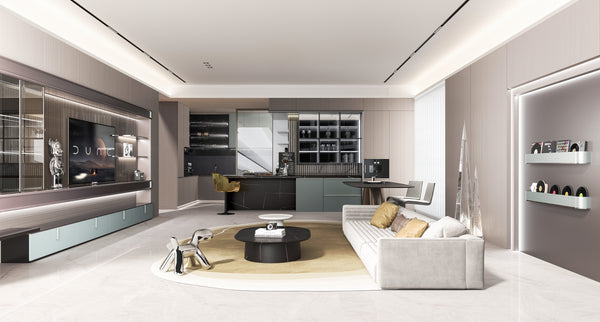 Modern living room with gray sofa, coffee table, and kitchen in the background.