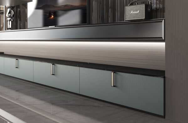 Modern kitchen with stainless steel appliances and gray cabinets.