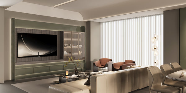 Modern living room with a large TV, sofa, and chairs.