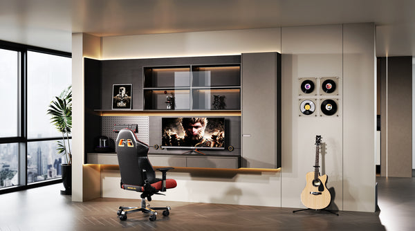 Modern home office with gaming chair, TV, and guitar in a stylish room.