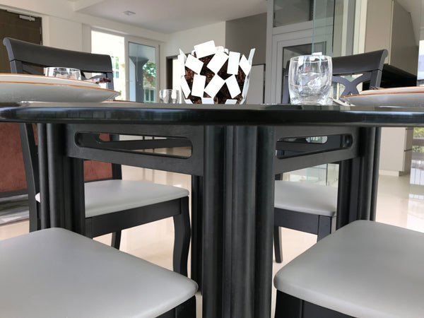 landed house living room in singapore with black dining table in solid wood plates glasses private lift