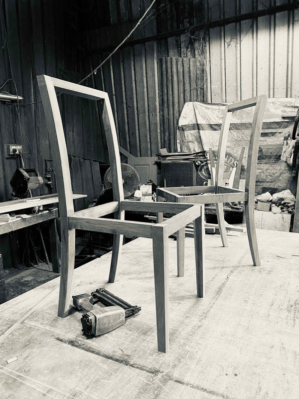 old carpentry workshop in singapore with solid wood furniture chair frame black and white