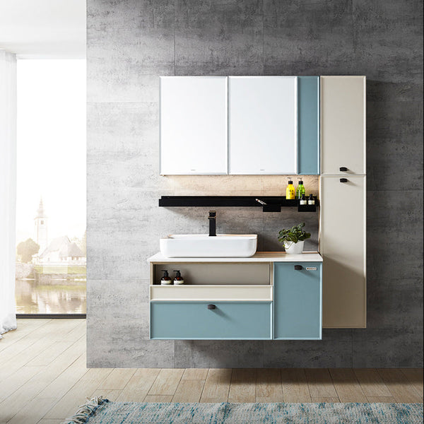 Bathroom vanity with sink and cabinets against a concrete wall.
