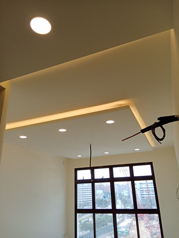 Ceiling with recessed lighting and a window view in a HDB in singapore as part of a bto project