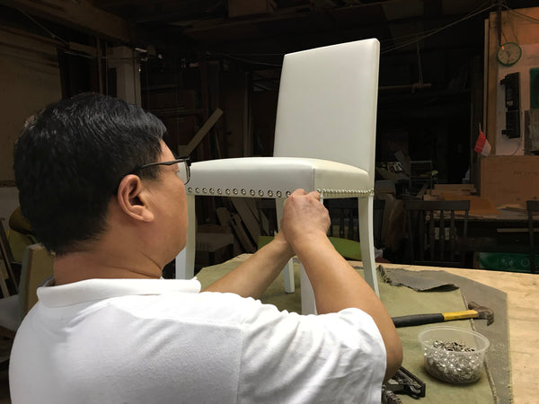 Carpenter Making Chair with Upholstery Nails Grey Leather in Singapore Workshop HomeShake