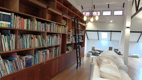 landed house attic singapore full height bookshelf in solid wood with sliding ladder