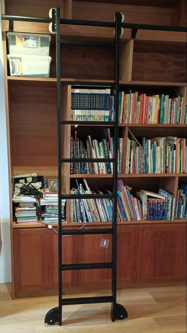 landed house attic in singapore with brown solid nyatoh wood bookshelf and black ladder