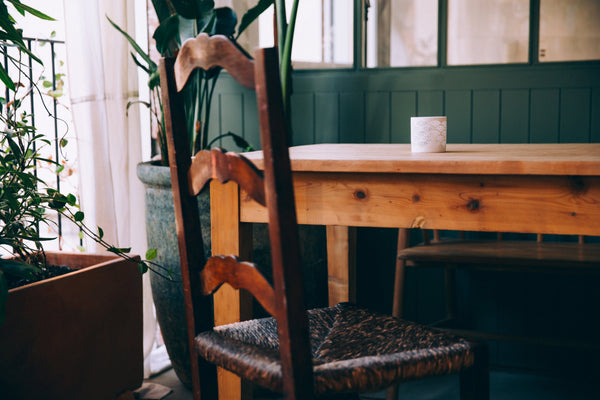 green room in singapore flat with rustic table and antique solid wood chair